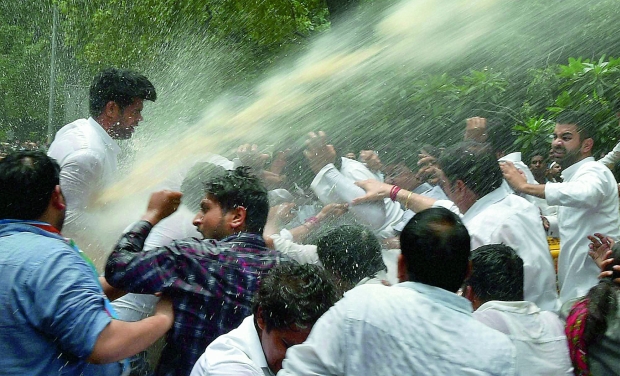 Police uses water cannons to disperse Youth Congress activists during a protest over Vyapam scam, near BJP office in New Delhi (Photo: PTI) Police uses water cannons to disperse Youth Congress activists during a protest over Vyapam scam, near BJP office in New Delhi (Photo: PTI)